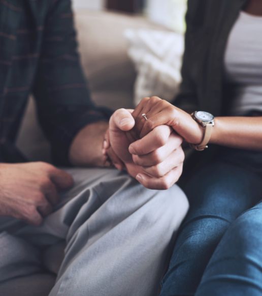 Couple holding hands